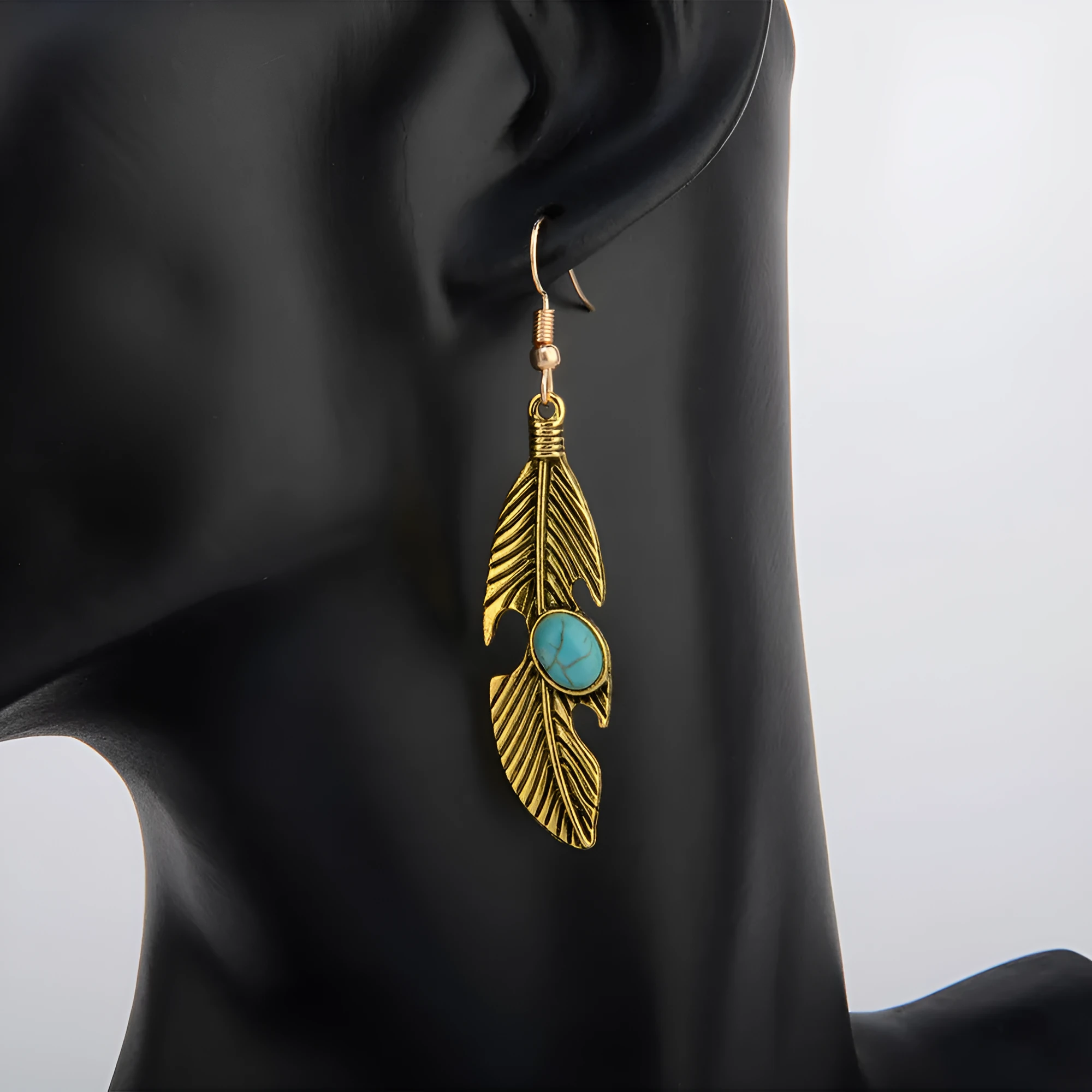 Vintage feather earrings with turquoise inlay leaf pattern in antique gold