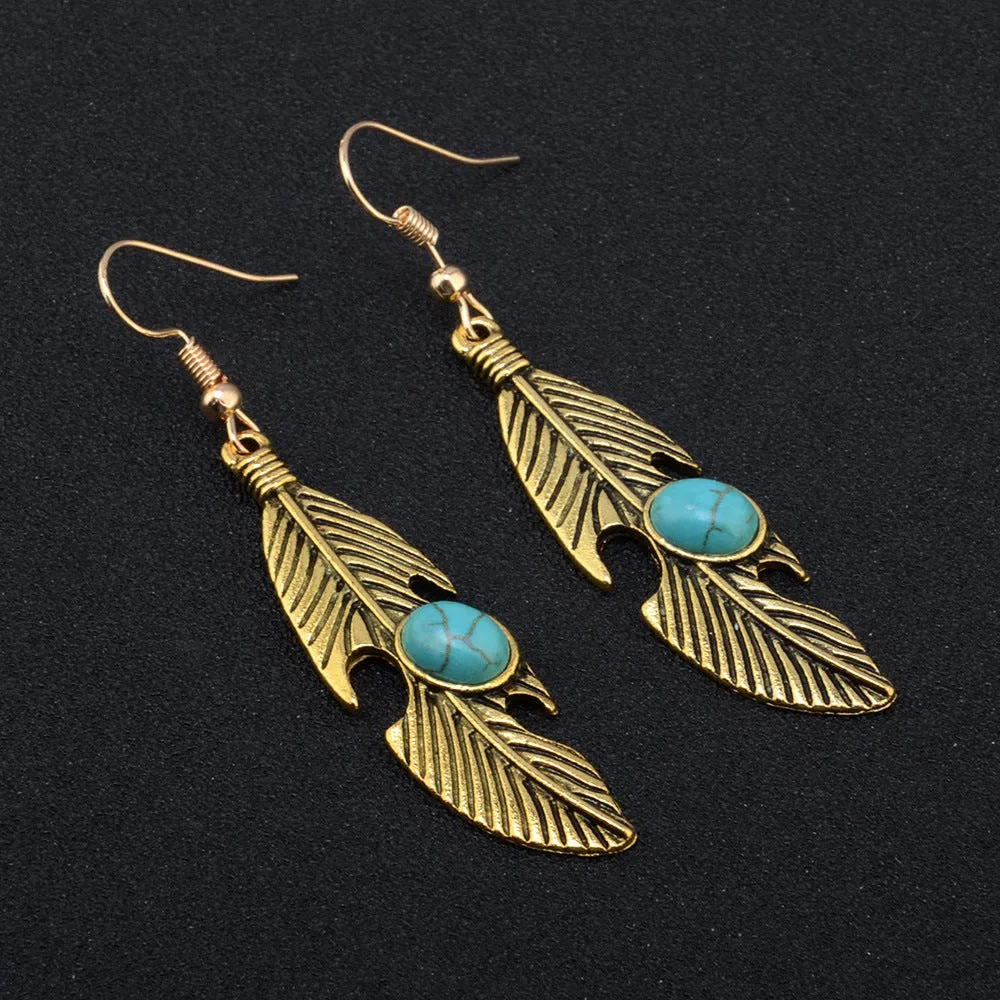 Vintage feather earrings with turquoise inlay leaf pattern in antique gold
