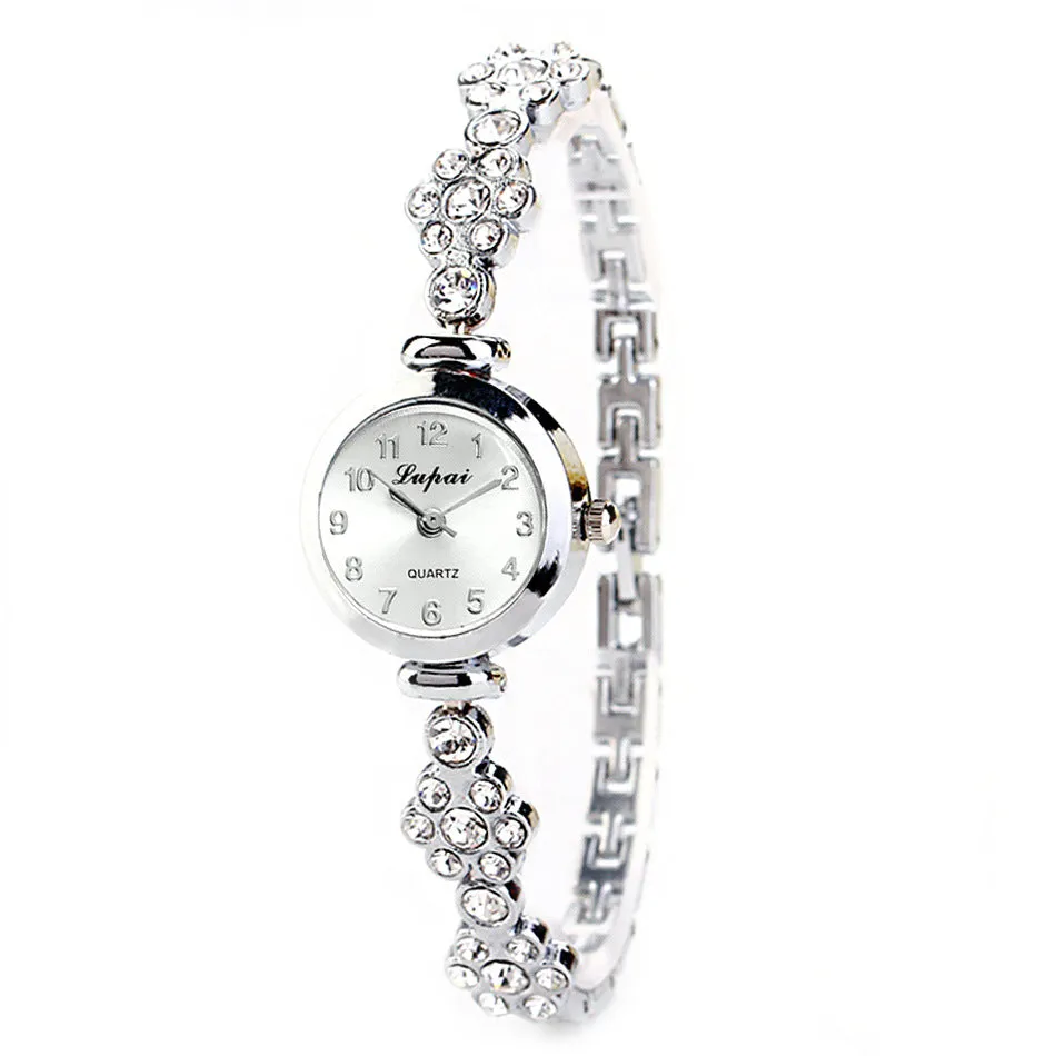 Ladies flower bracelet watch with round dial and silicone strap in gold colour