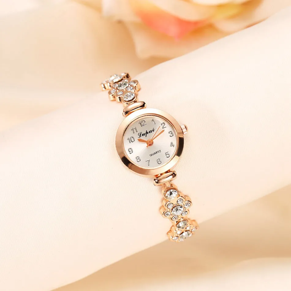 Ladies flower bracelet watch with round dial and silicone strap in gold colour