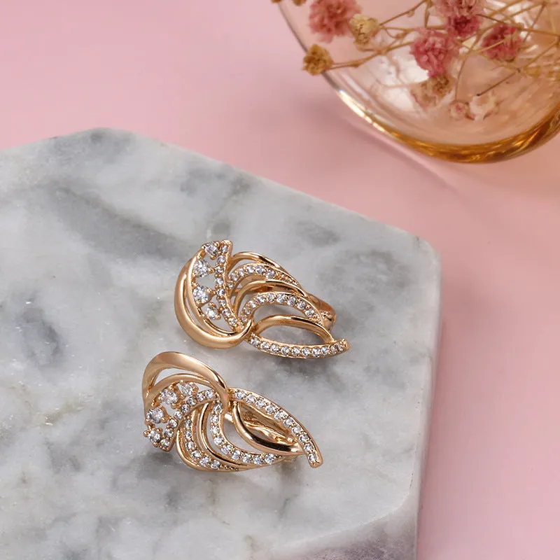 Gold geometric wing-shaped ear clips with micro inlaid stones on U-shaped copper clips