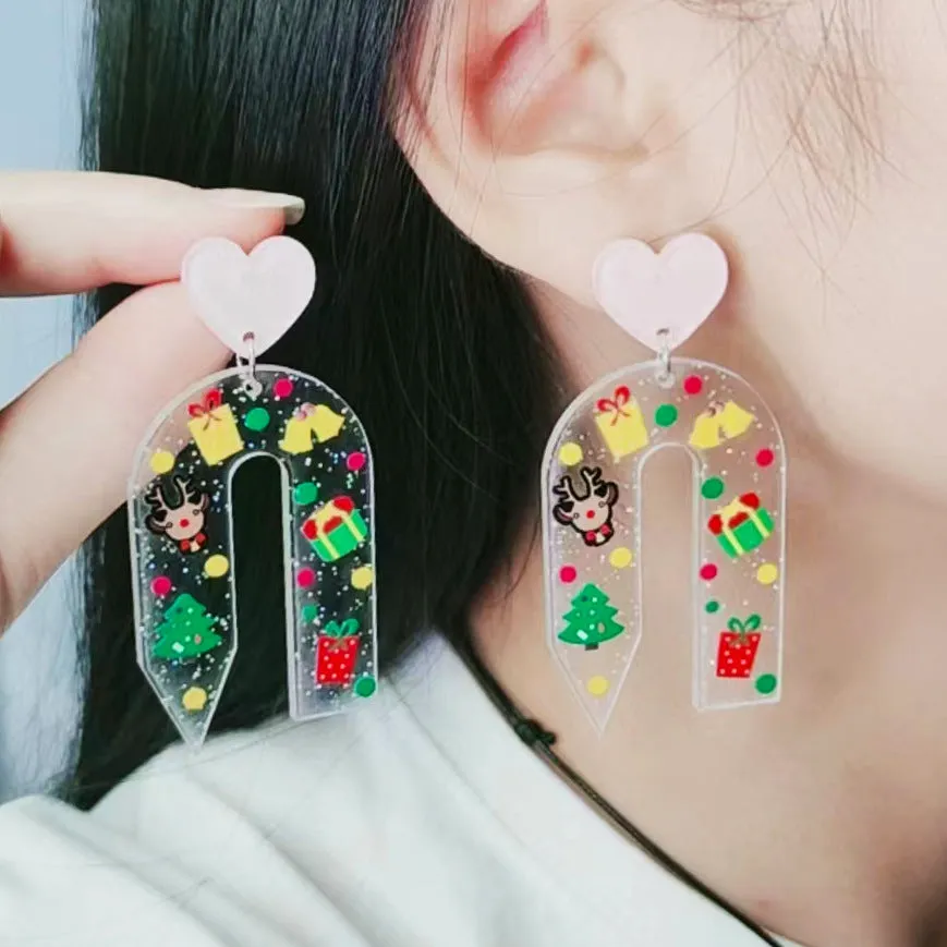 Christmas ear studs in acrylic with geometric shape and printed snowflake design, 6.5x3.1cm