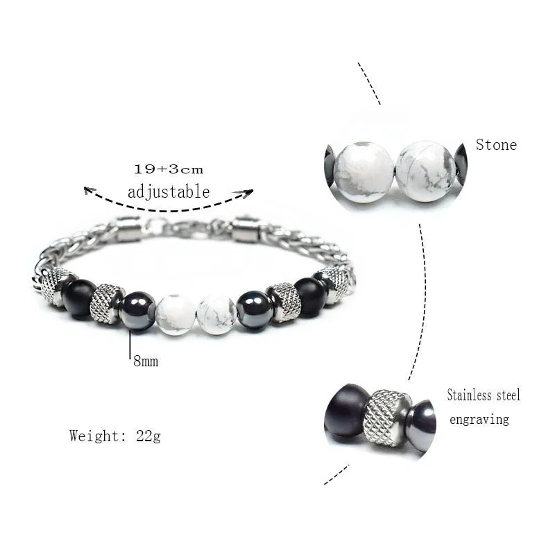 Titanium steel polished bracelet with yellow tiger eye beads and iron accents on white background