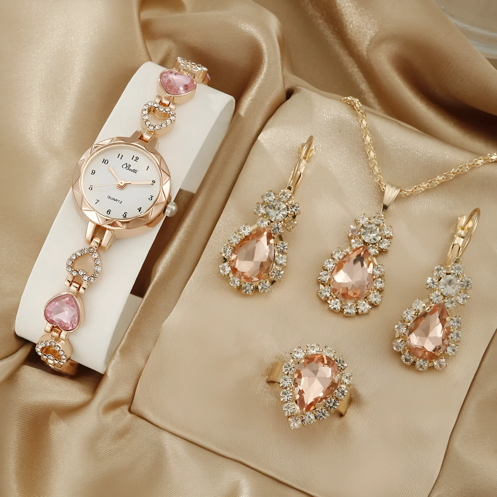Women's simple disc light luxury quartz bracelet watch set in pink with matching earrings necklace and ring
