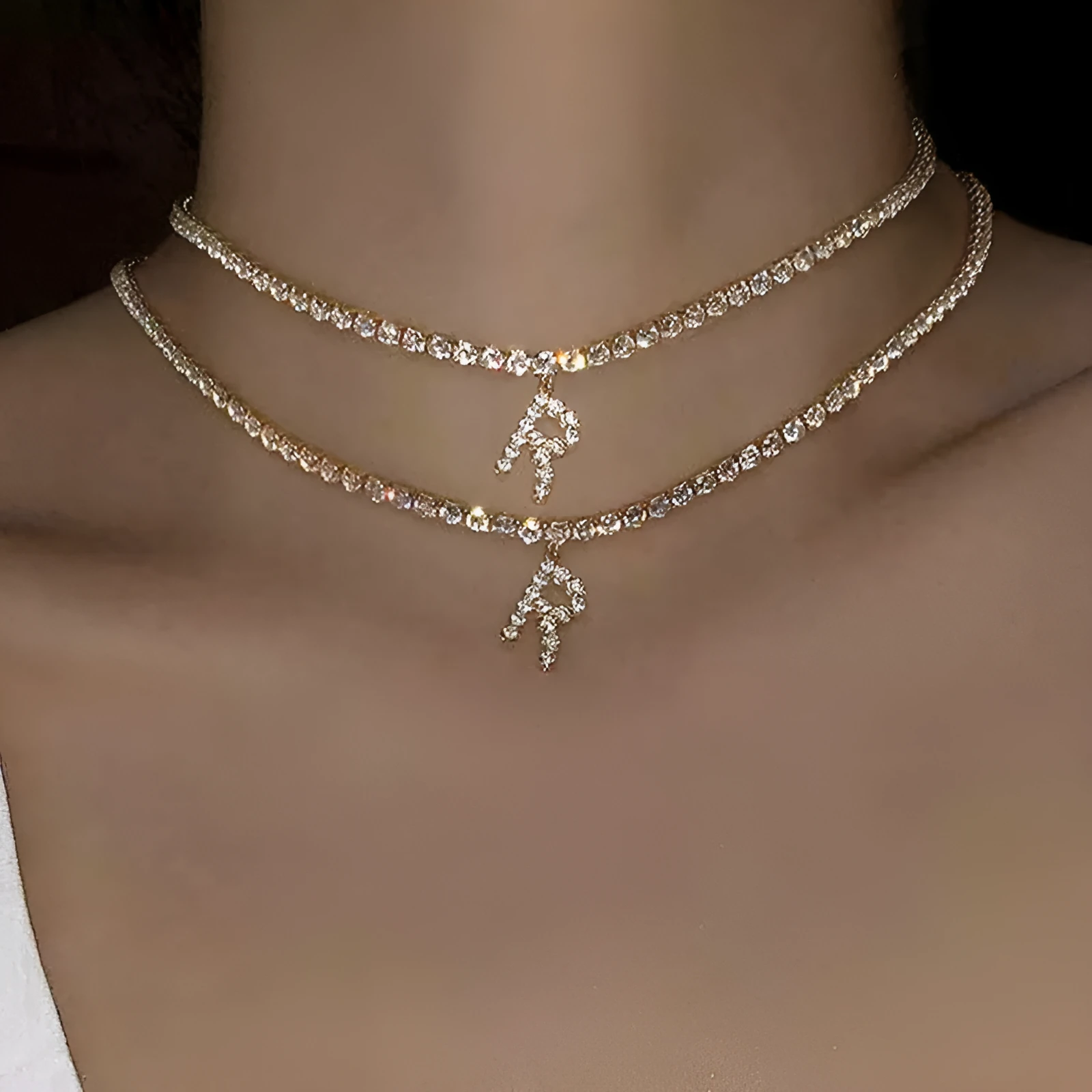 Personalised diamond letter necklace with rhinestone pendant on claw chain in gold finish