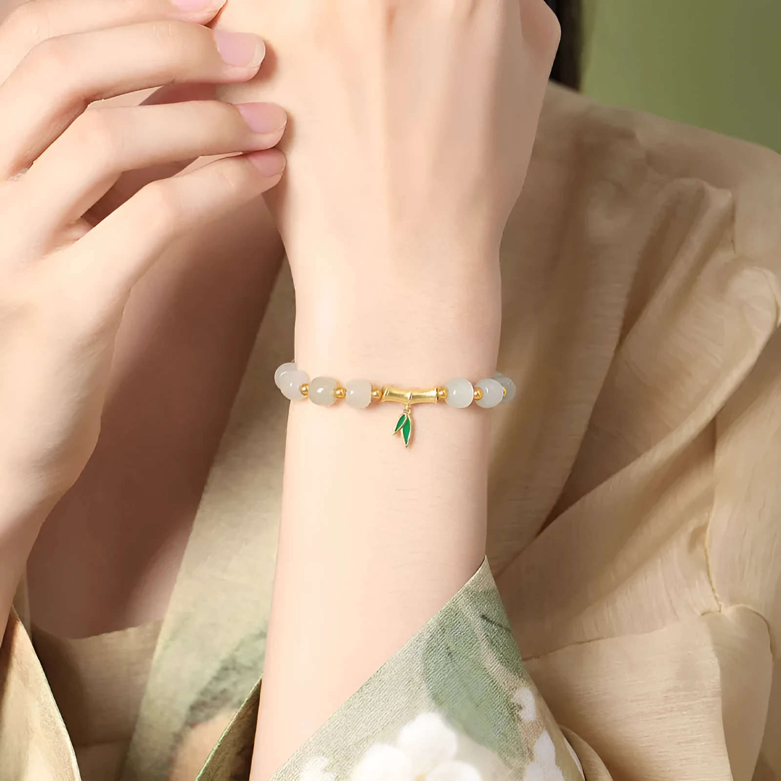 Women's S925 sterling silver bracelet with 6mm Hetian jade bamboo leaf beads in gold colour finish