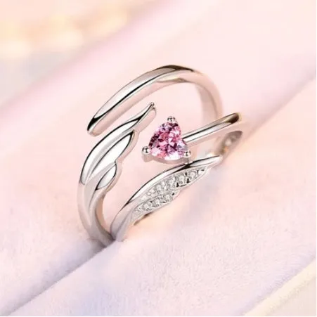 Silver adjustable heart diamond ring with geometric design on a plain background