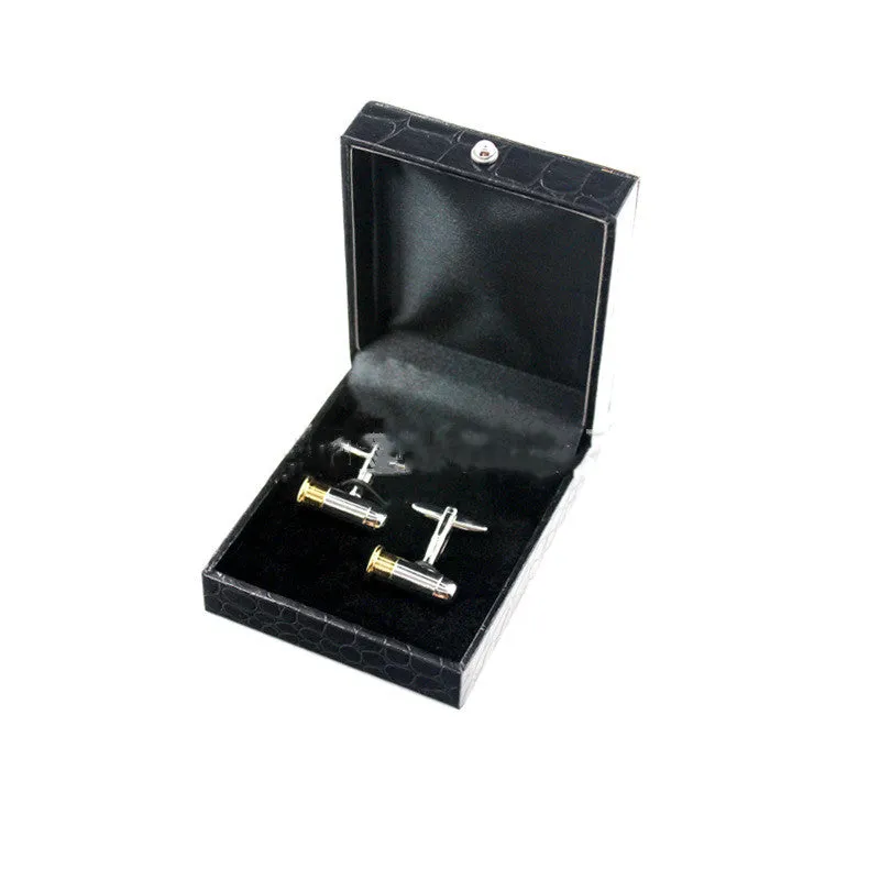 Silver geometric men's cufflinks with copper body and mechanical watch movement on dress shirt cuff