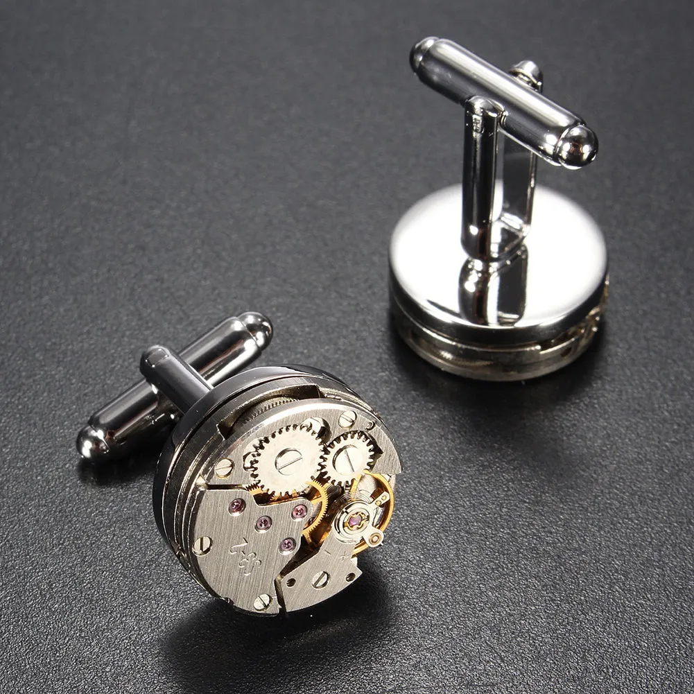 Silver geometric men's cufflinks with copper body and mechanical watch movement on dress shirt cuff