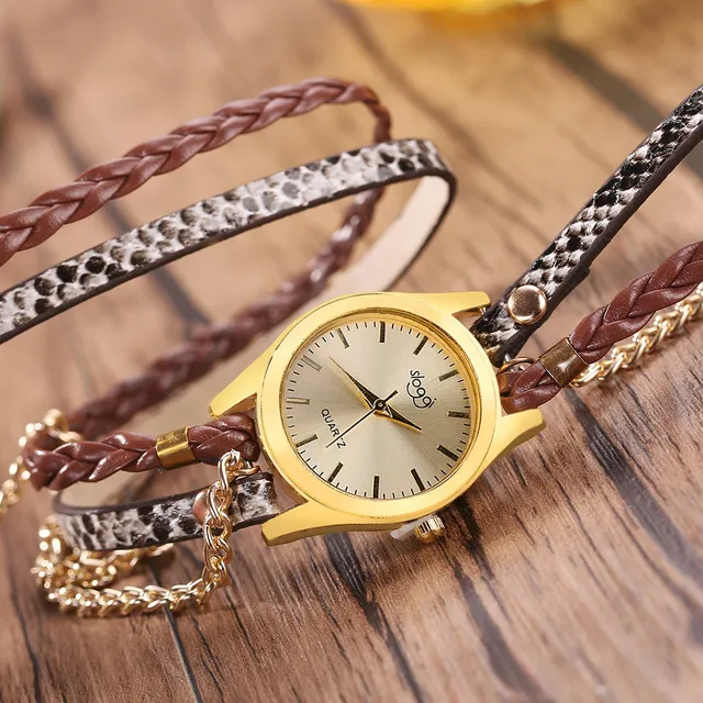 Women's casual watch with imitation leather strap and alloy pin buckle on white background