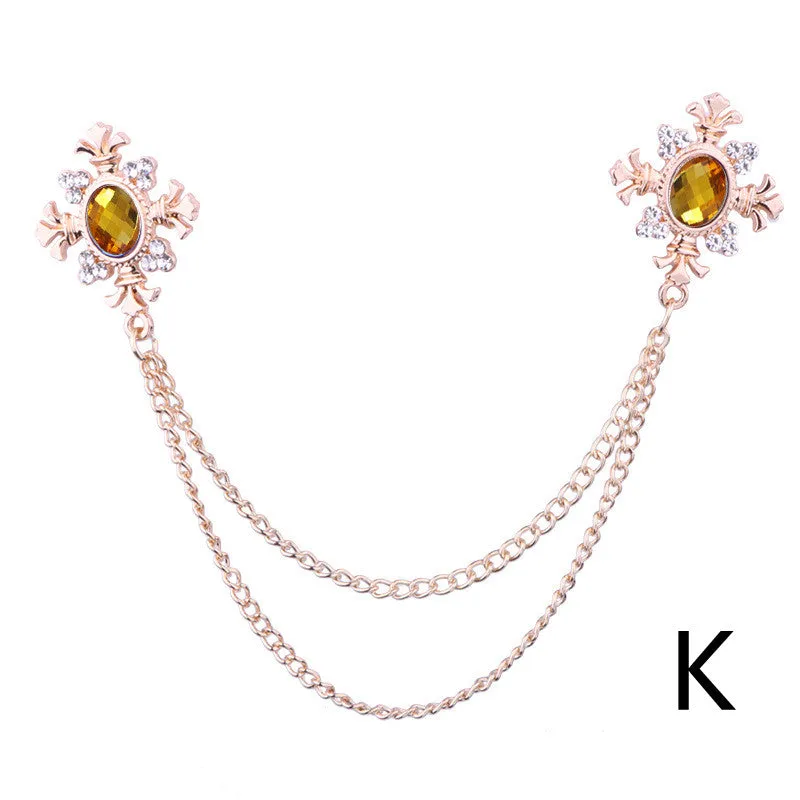 Fringed rhinestone cross collar pin in alloy with electroplated finish and inlaid rhinestones.