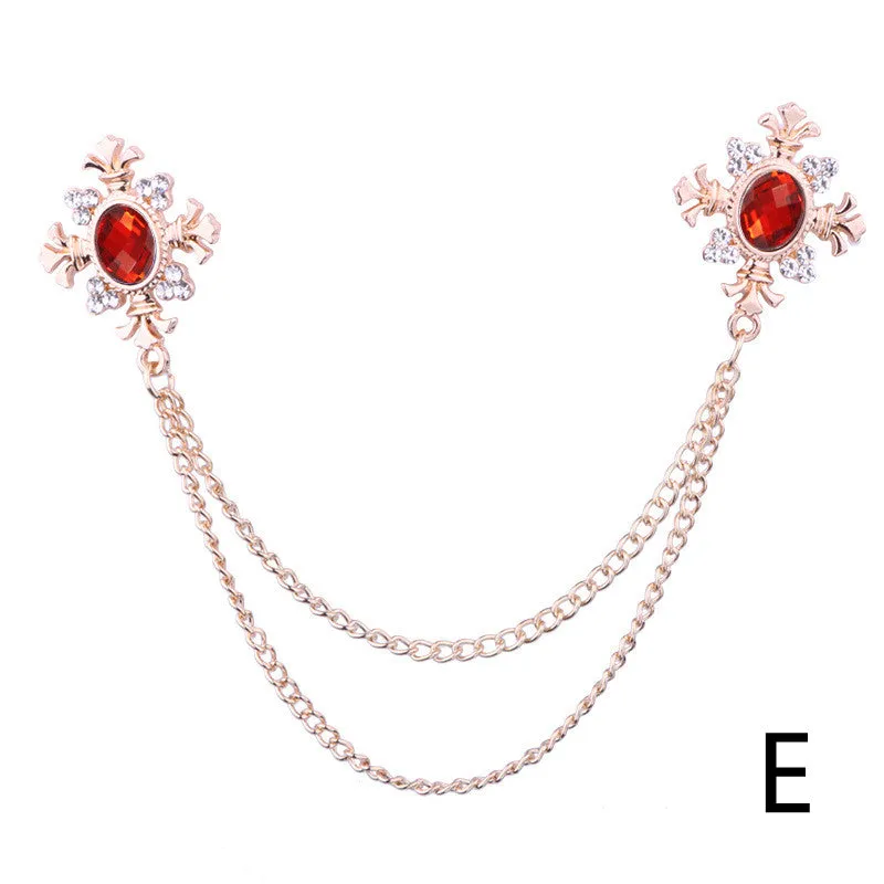Fringed rhinestone cross collar pin in alloy with electroplated finish and inlaid rhinestones.