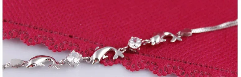 925 sterling silver heart-shaped bracelet with inlaid diamond style, available in purple and white on wrist