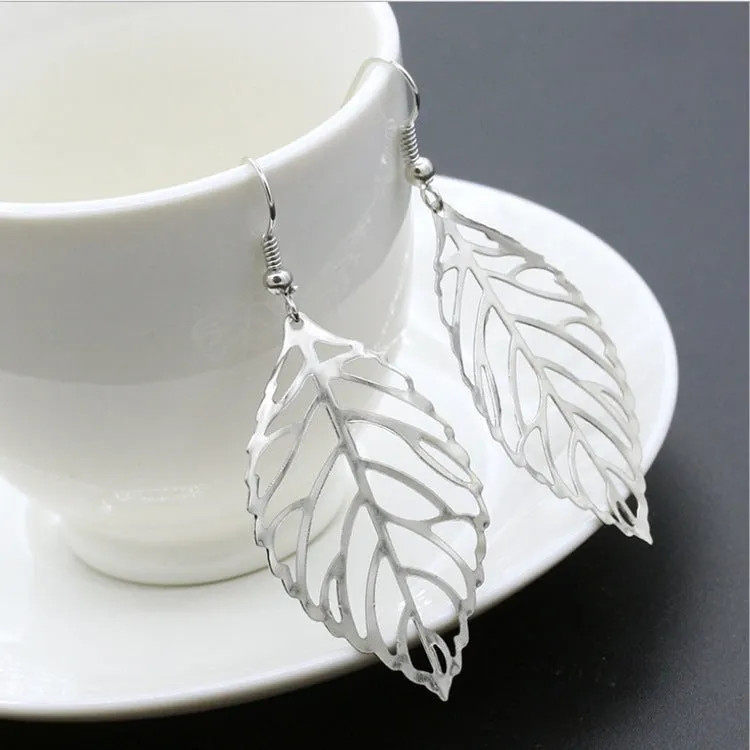 Triangle shaped alloy earrings for women in green colour option
