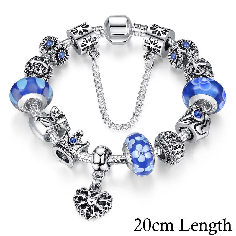 Silver plated alloy bracelet with queen crown beads and pink Murano glass beads for women on white background