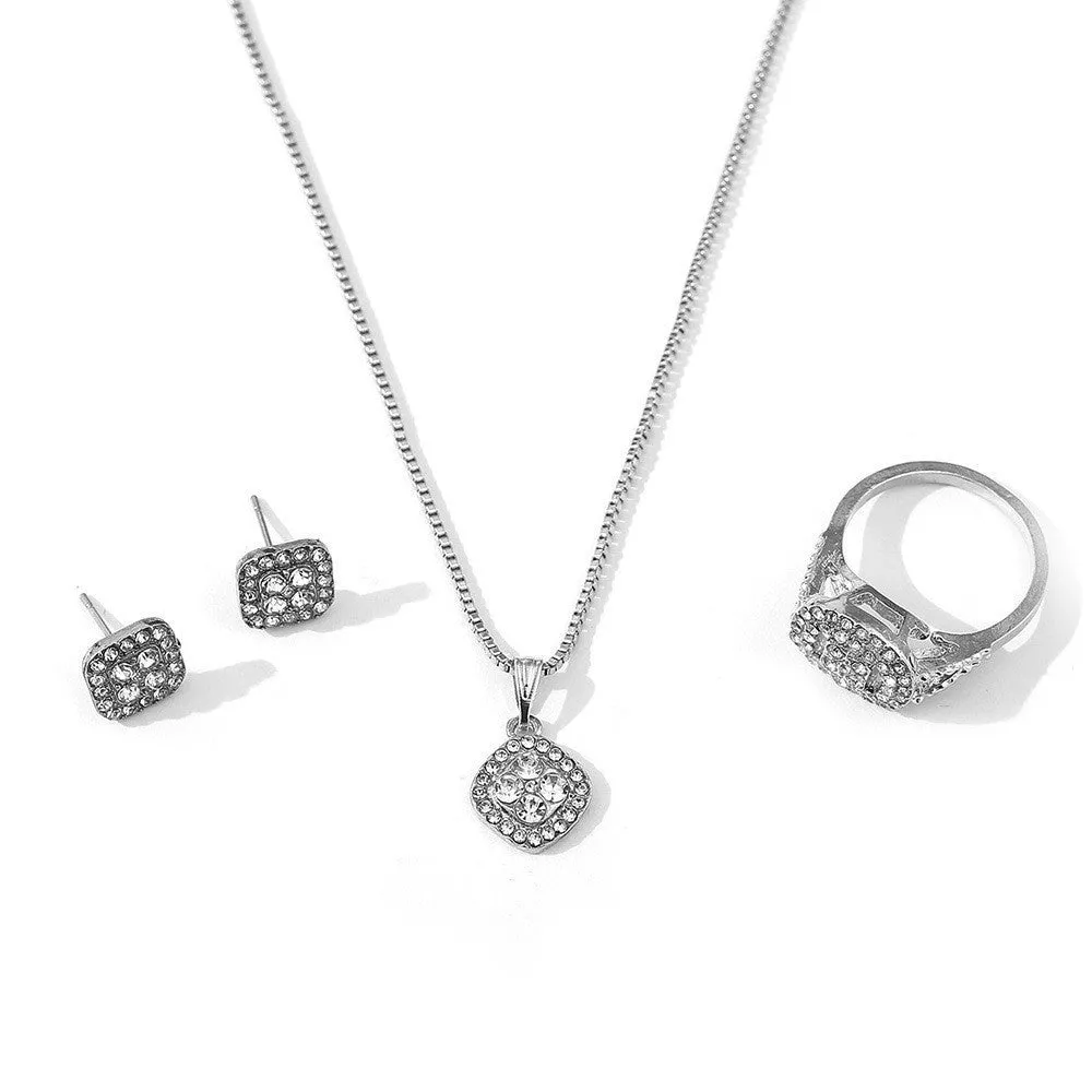 Three-piece alloy rhinestone wedding jewellery set with ring, stud earrings, and necklace in gold finish