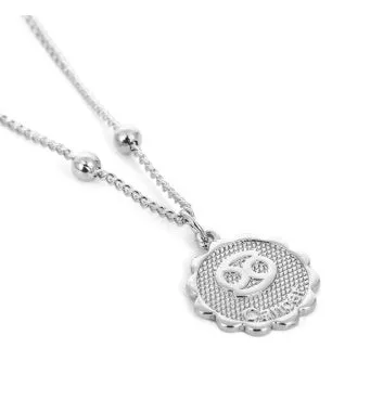 Gold plated metal zodiac constellation pendant necklace with bead chain on white background