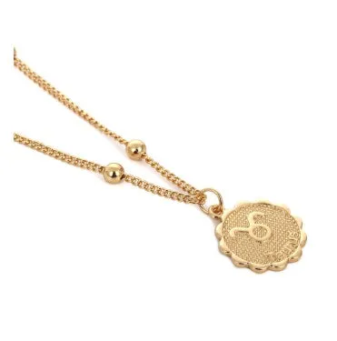 Gold plated metal zodiac constellation pendant necklace with bead chain on white background