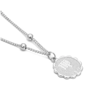 Gold plated metal zodiac constellation pendant necklace with bead chain on white background