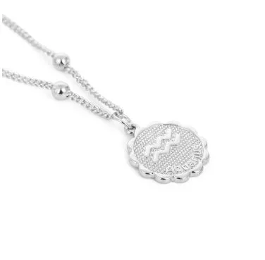 Gold plated metal zodiac constellation pendant necklace with bead chain on white background