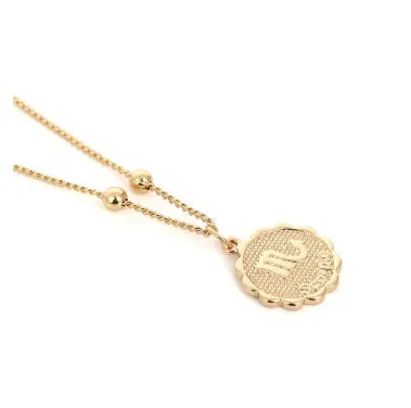 Gold plated metal zodiac constellation pendant necklace with bead chain on white background