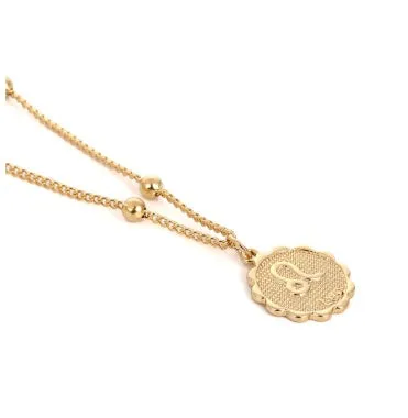 Gold plated metal zodiac constellation pendant necklace with bead chain on white background