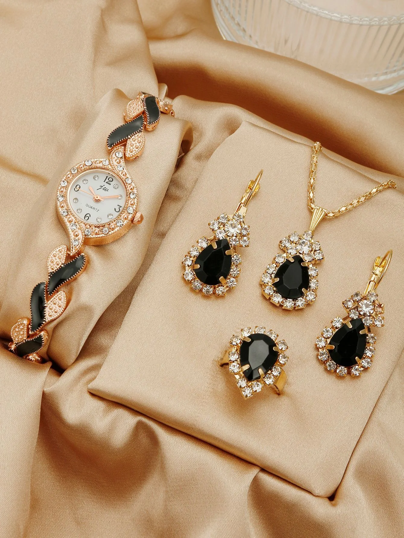 Women's love strap diamond watch with matching earrings, ring, and necklace in black suit option