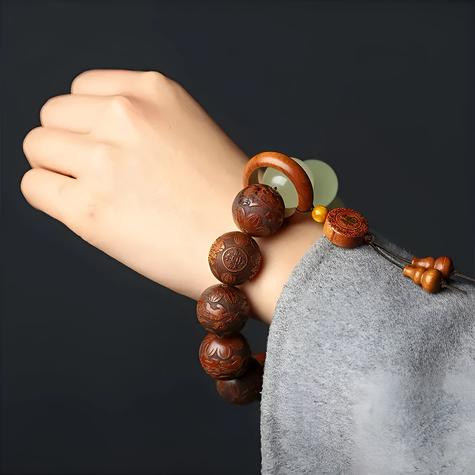 Flexible rosewood bead bracelet with carved Fu character in amass fortunes colour.
