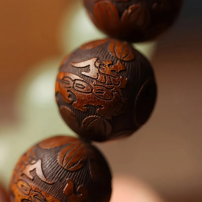 Flexible rosewood bead bracelet with carved Fu character in amass fortunes colour.