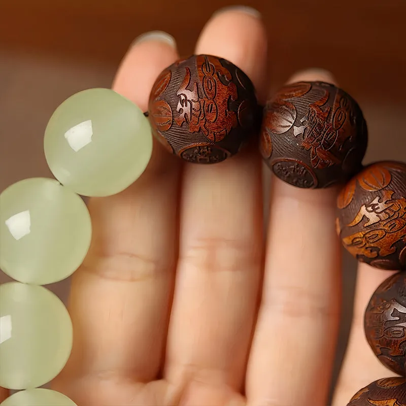 Flexible rosewood bead bracelet with carved Fu character in amass fortunes colour.