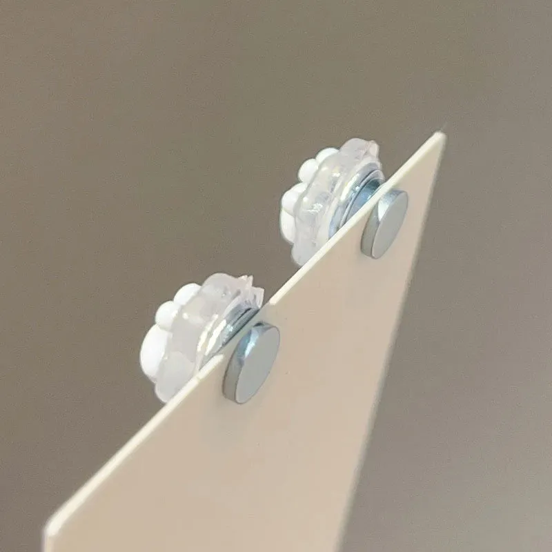 Cat paw magnetic ear clips in transparent pink colour with plastic resin finish, packaged as one pair