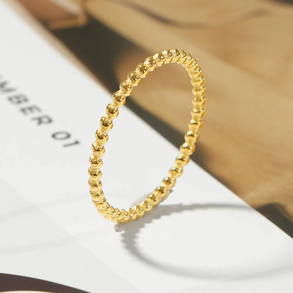 Titanium steel plain circle ring in gold finish on a neutral background