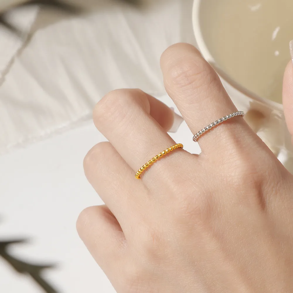 Titanium steel plain circle ring in gold finish on a neutral background