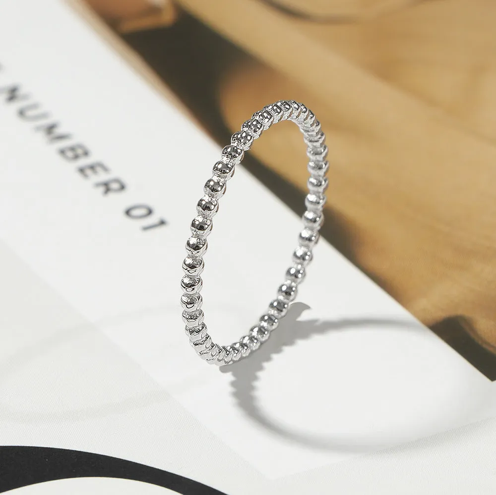 Titanium steel plain circle ring in gold finish on a neutral background