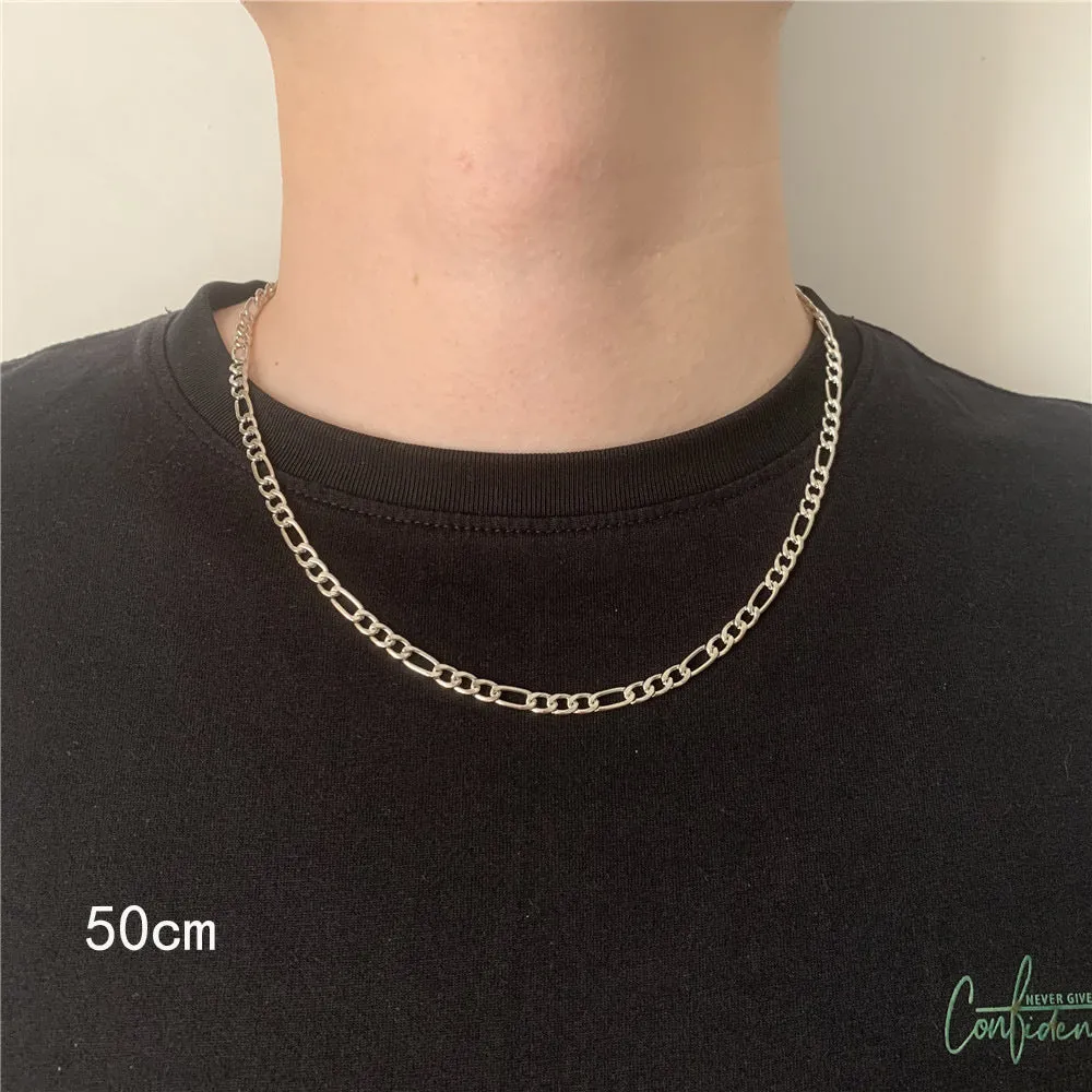Men's simple electroplated alloy necklace in gold on a grey background