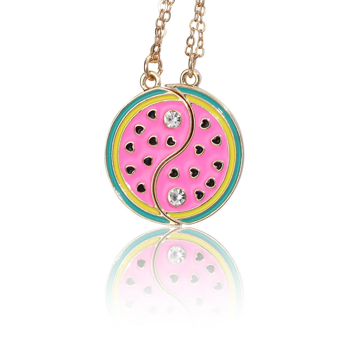 Two matching zinc alloy pendants in donut and watermelon shapes with glossy oil drip finish on cross chains