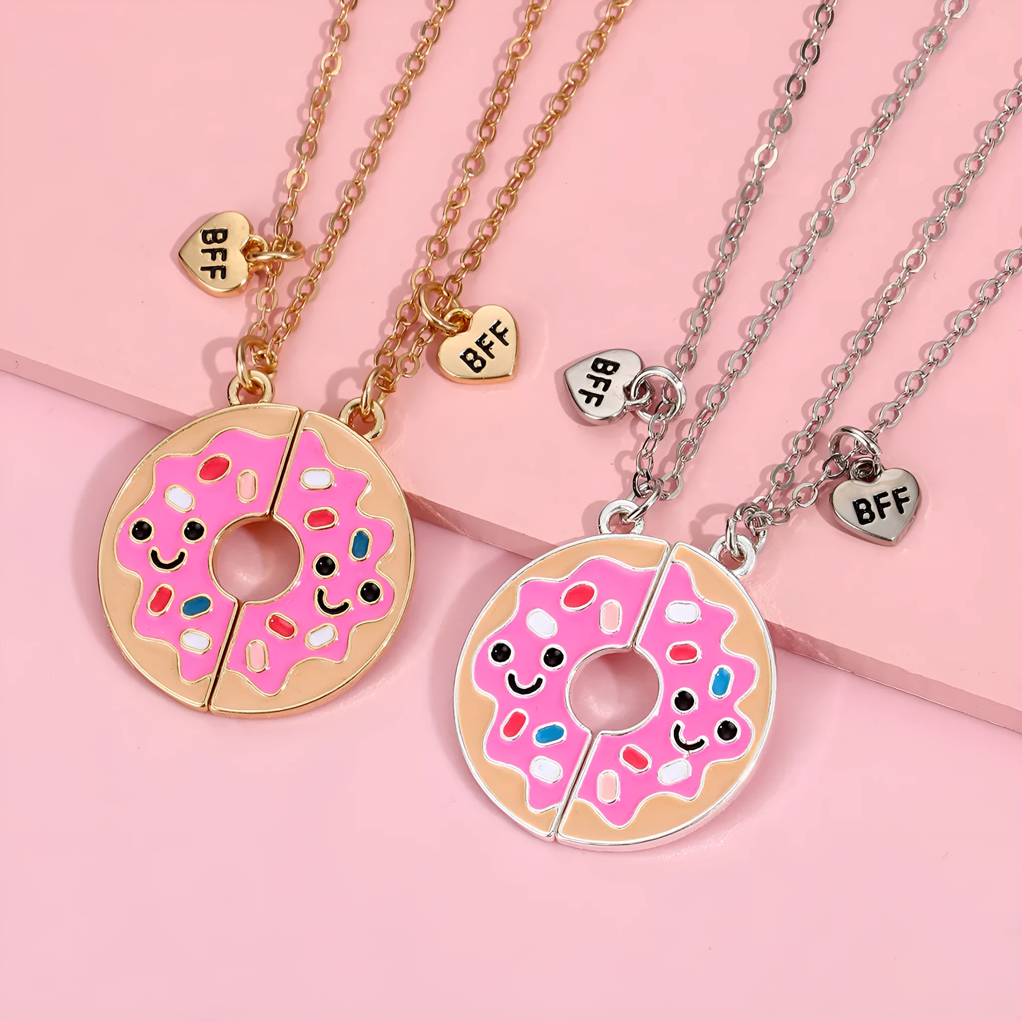 Two matching zinc alloy pendants in donut and watermelon shapes with glossy oil drip finish on cross chains