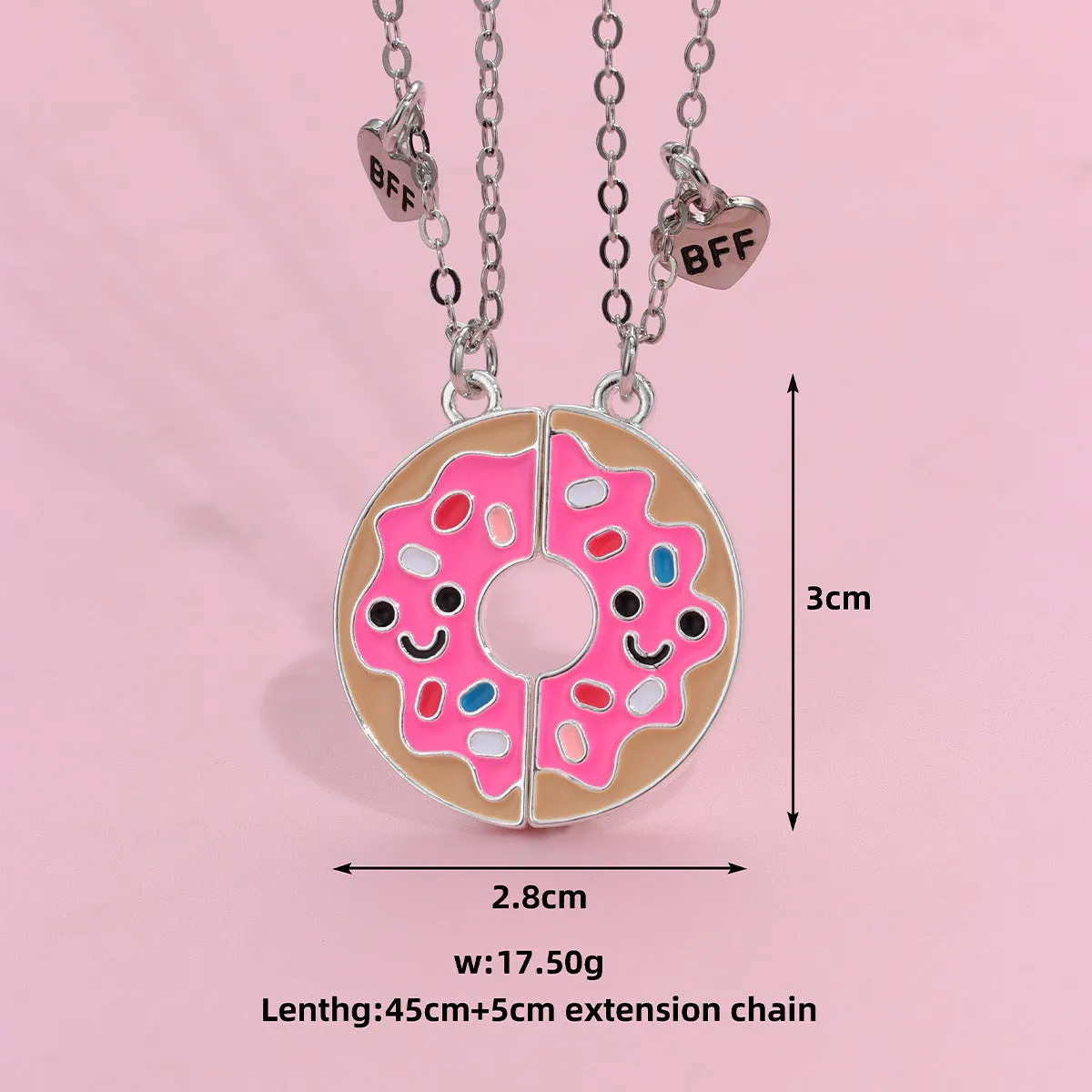 Two matching zinc alloy pendants in donut and watermelon shapes with glossy oil drip finish on cross chains