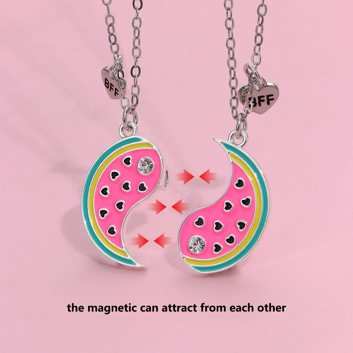 Two matching zinc alloy pendants in donut and watermelon shapes with glossy oil drip finish on cross chains