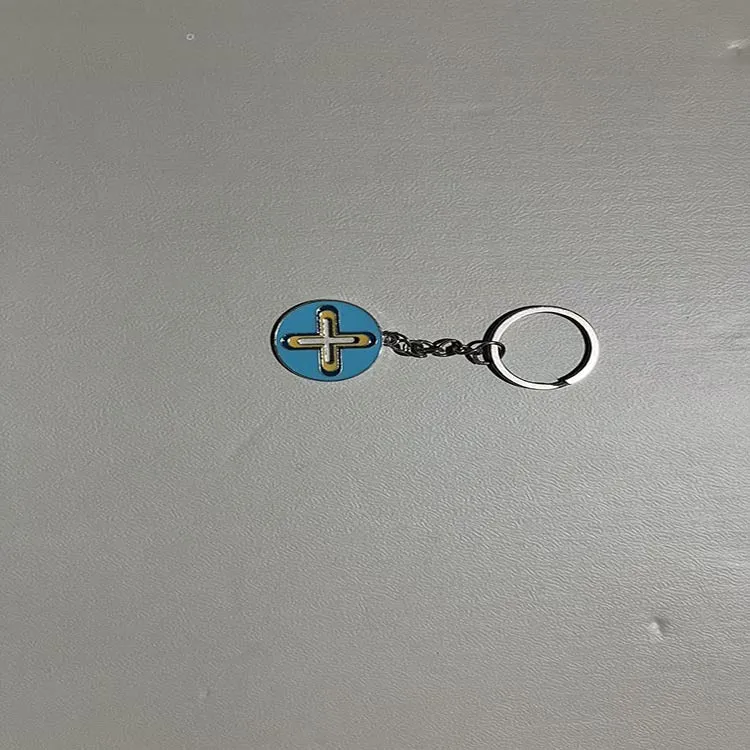 Colourful pendant keychain made of zinc alloy in eight colour options including black, blue, green, pink, purple, red, sky blue, yellow.