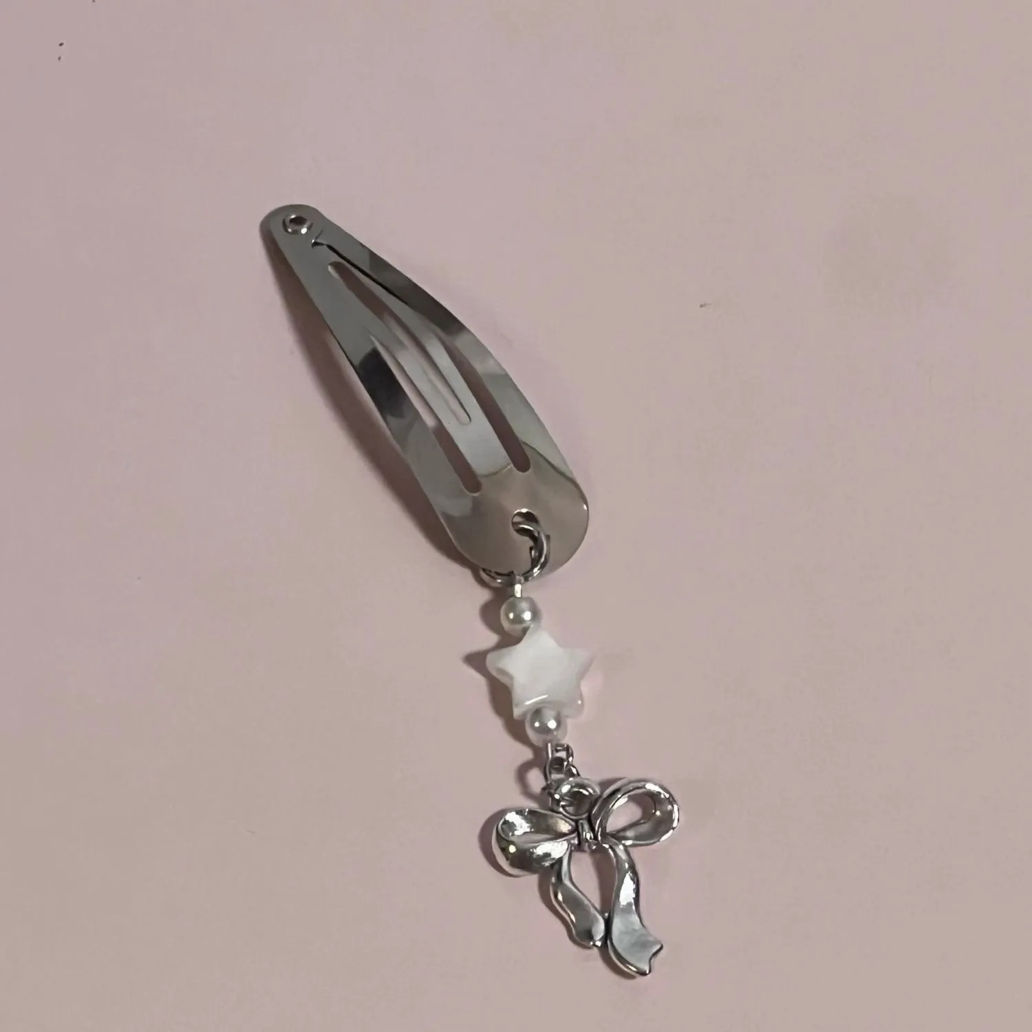 Silver star bow metal hair clip with electroplated finish, single pack
