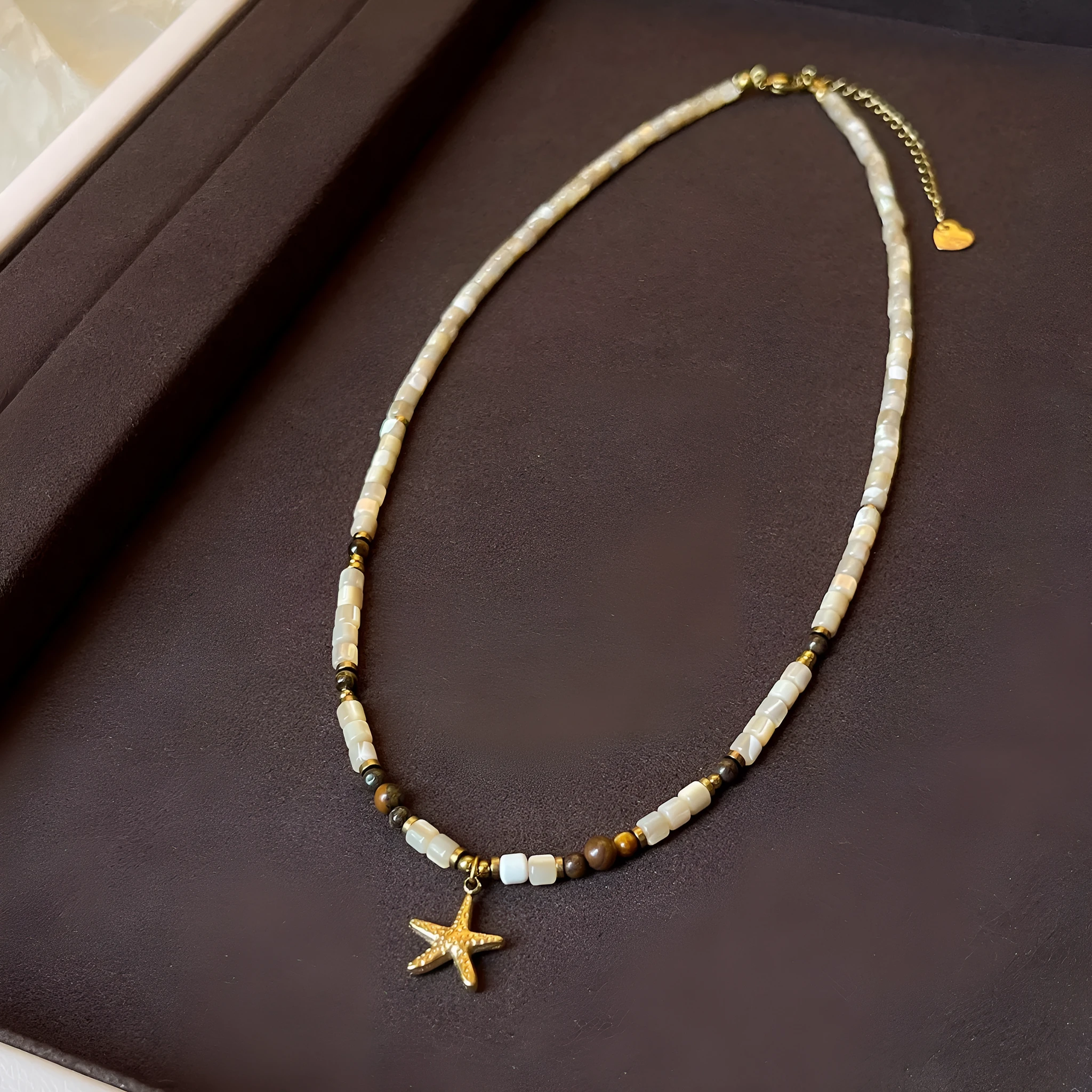 Titanium steel starfish pendant necklace with natural shell and tigereye beads on a Maillard style chain
