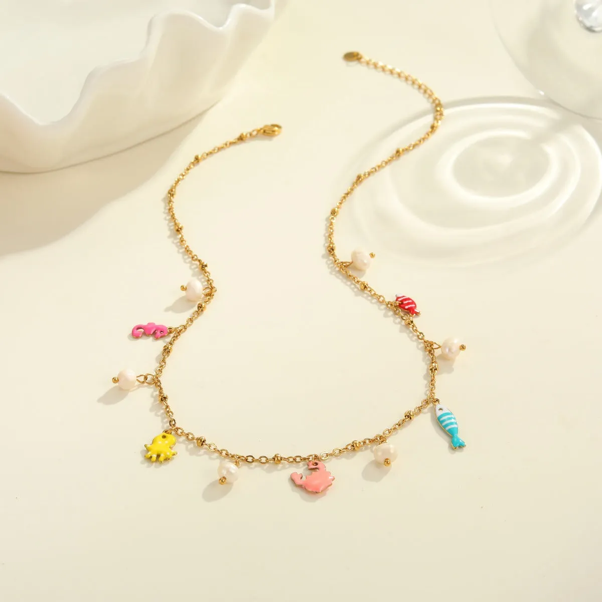 Stainless steel pendant necklace with geometric shape and 18K gold electroplating, paired with a titanium steel bracelet, for women