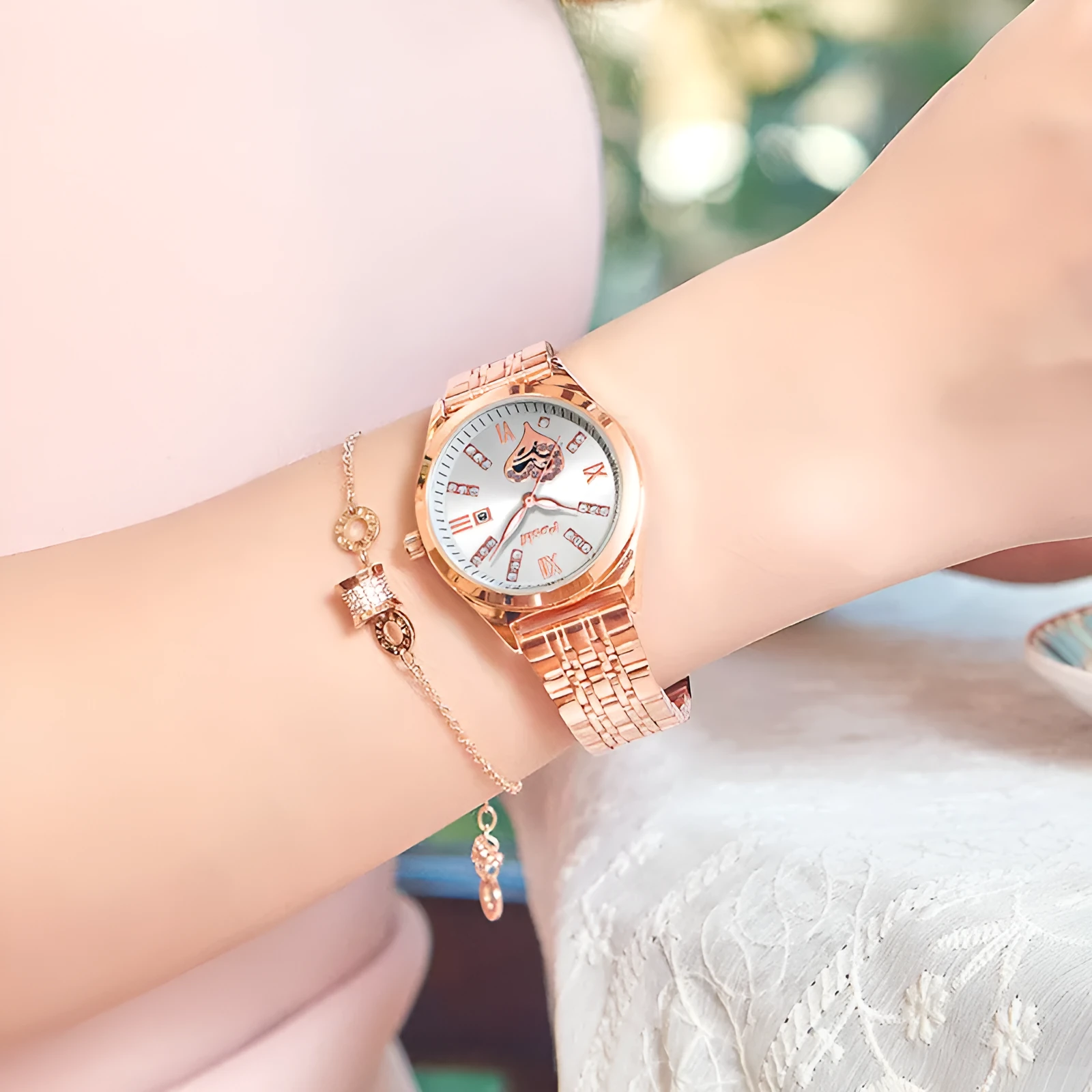 Women's casual alloy strap watch with Roman numeral rhinestone dial, luminous hands, and calendar window