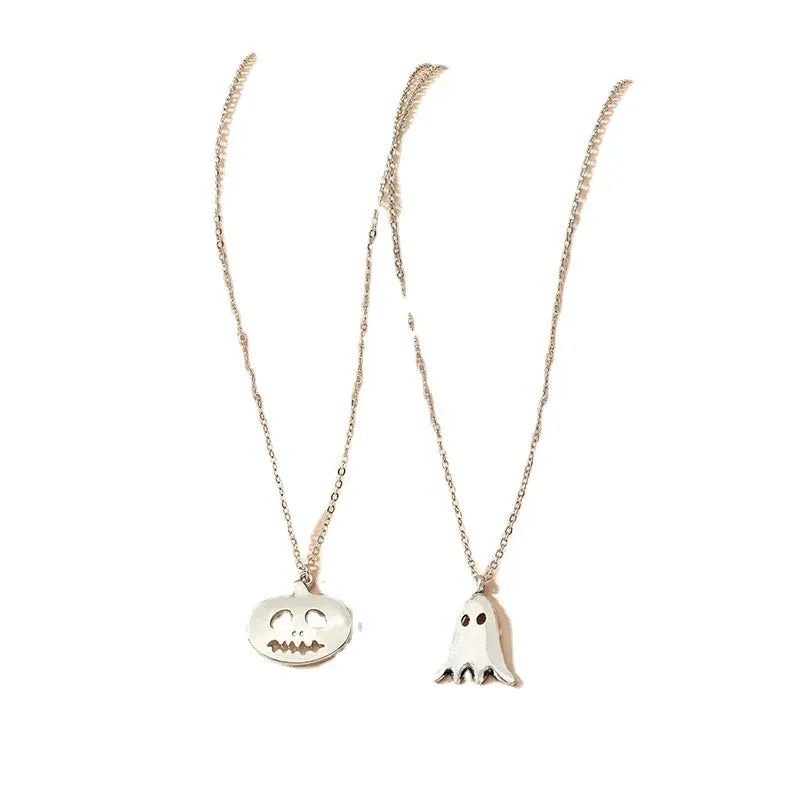 Two silver alloy pendant necklaces: one cartoon pumpkin and one cartoon ghost on a light background