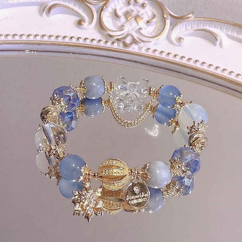 Women's galaxy colour bracelet with snowflake pendant, bow decoration, heart shapes and cartoon character details