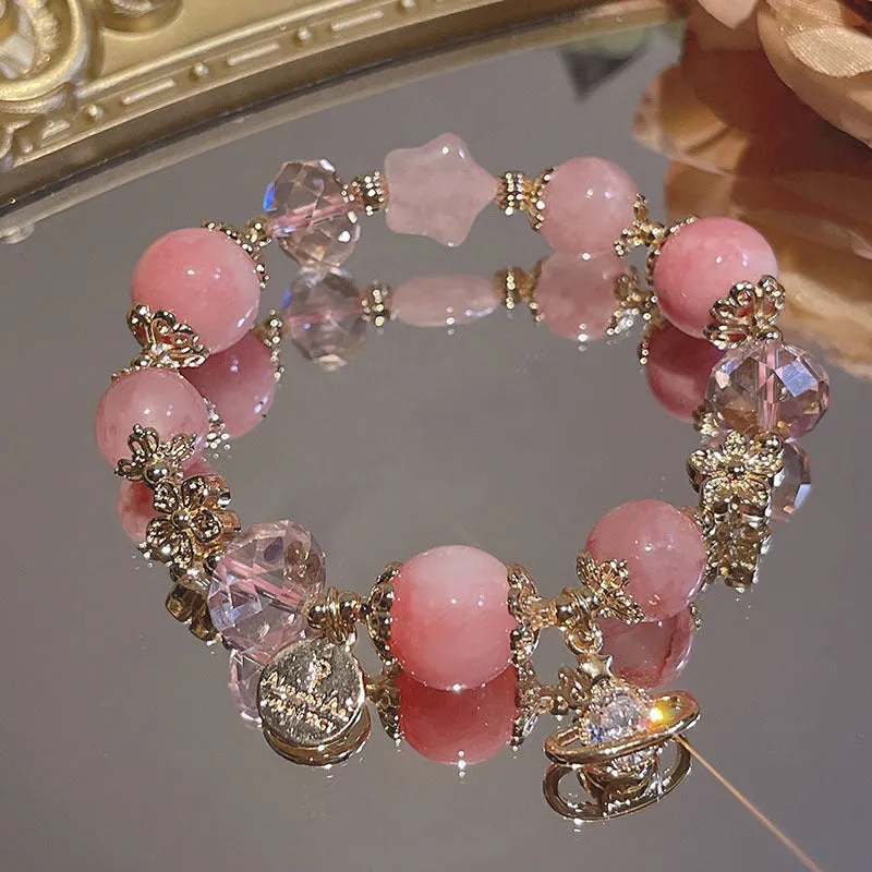 Women's galaxy colour bracelet with snowflake pendant, bow decoration, heart shapes and cartoon character details