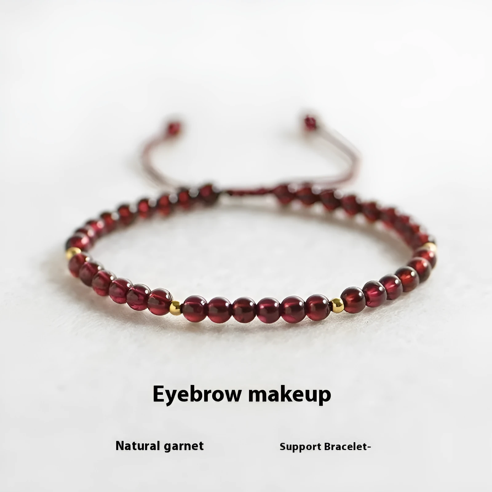 Hand-woven garnet red bracelet with flexible wire rope construction and Chinese national tide design