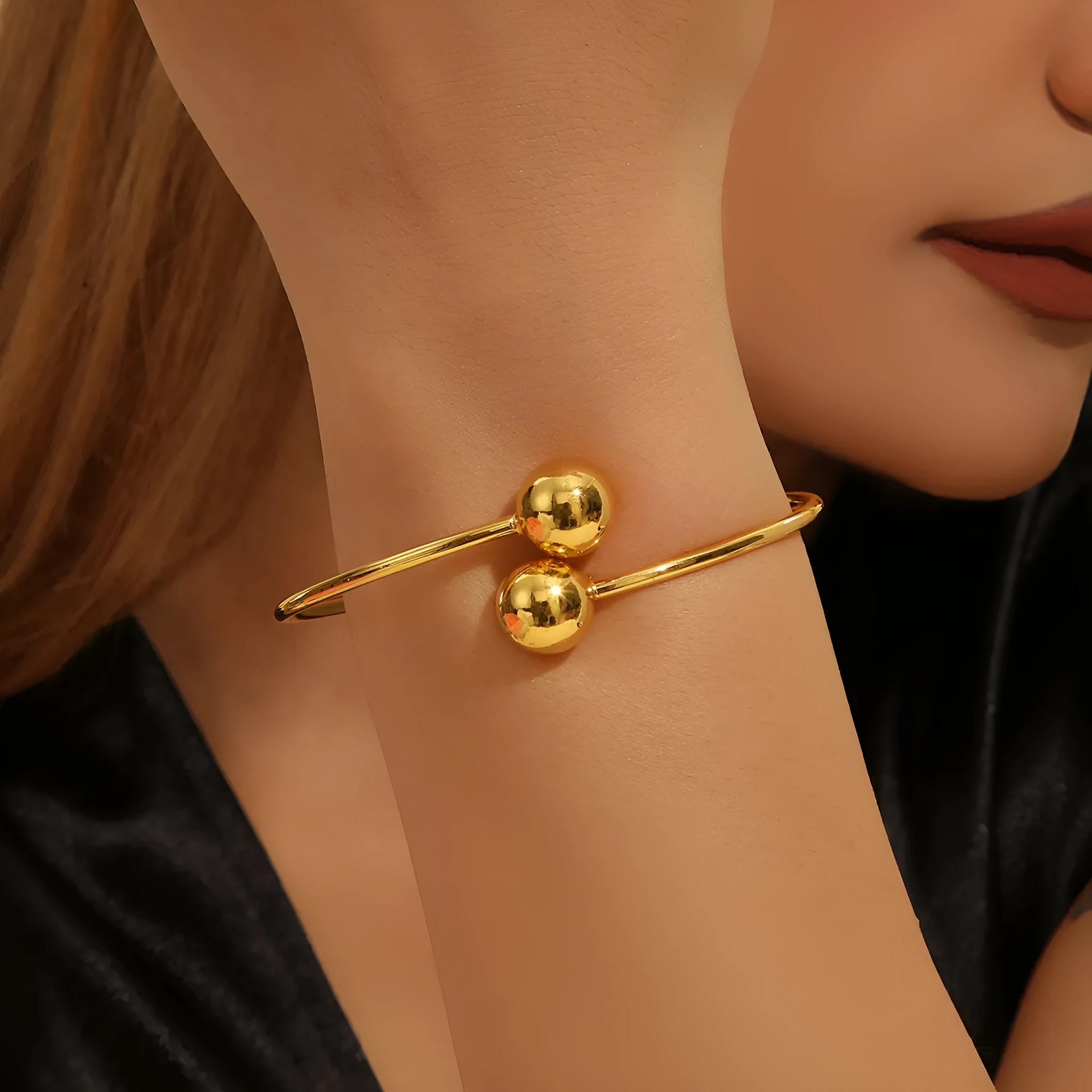 Golden copper plated 18k gold double bead opening bracelet on white background