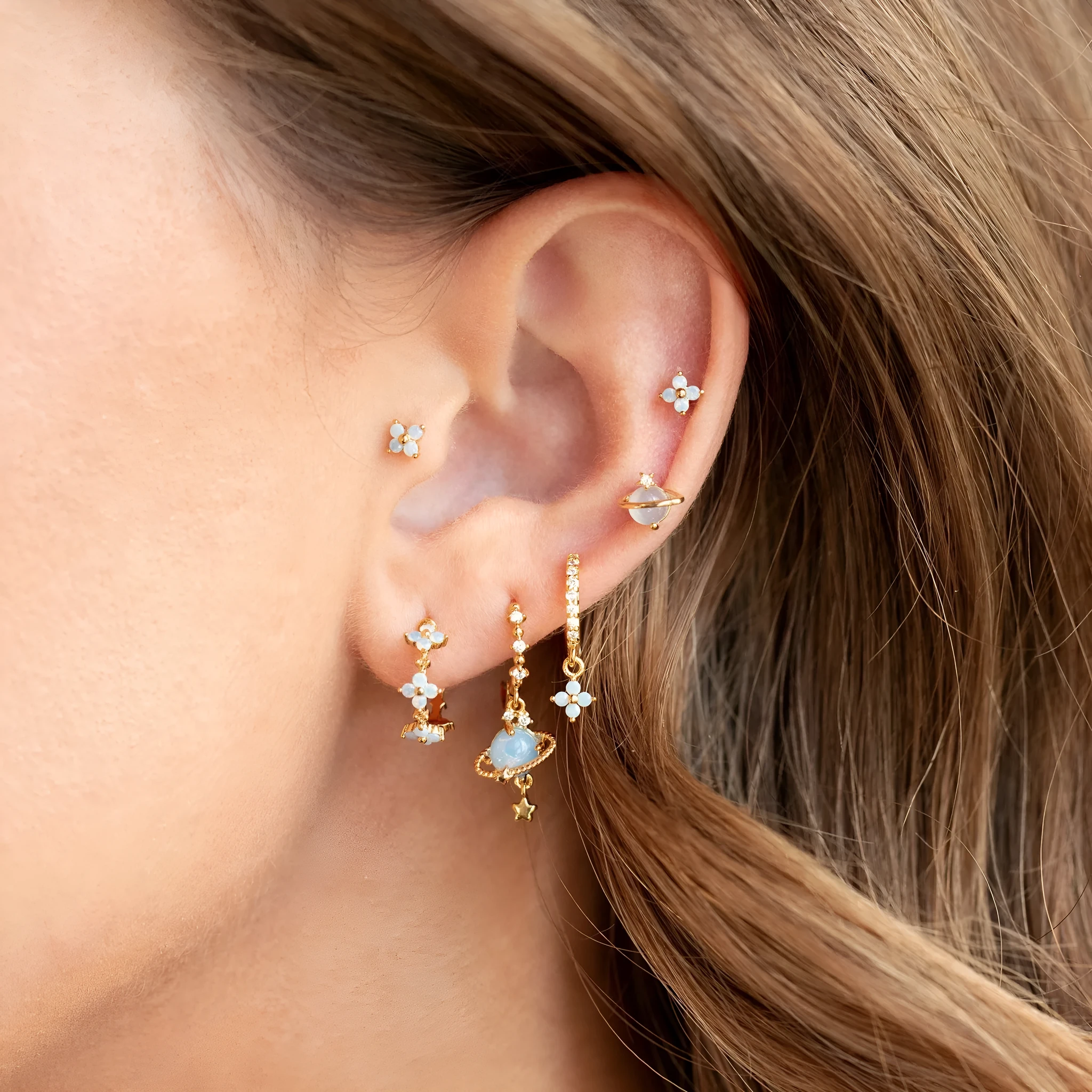 Gold and silver floral stud earrings with zircon detail in a Japanese Korean sweet girl style.